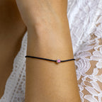 Armband katoen synth. robijn 15,5 + 2,5 cm zilver gerhodineerd met rubber/nylon/leer