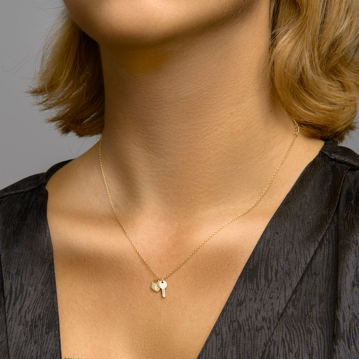 Collier hart en sleutel 41 + 4 cm zilver verguld (geel)