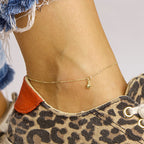 Enkelbandje ster 24 - 26 cm 14k geelgoud