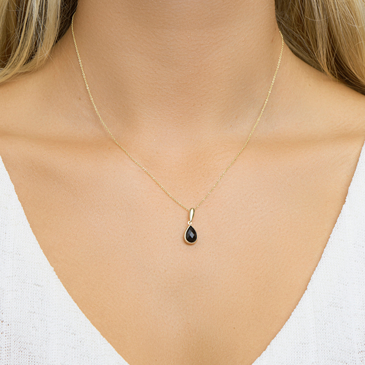 Hanger onyx 14k geelgoud