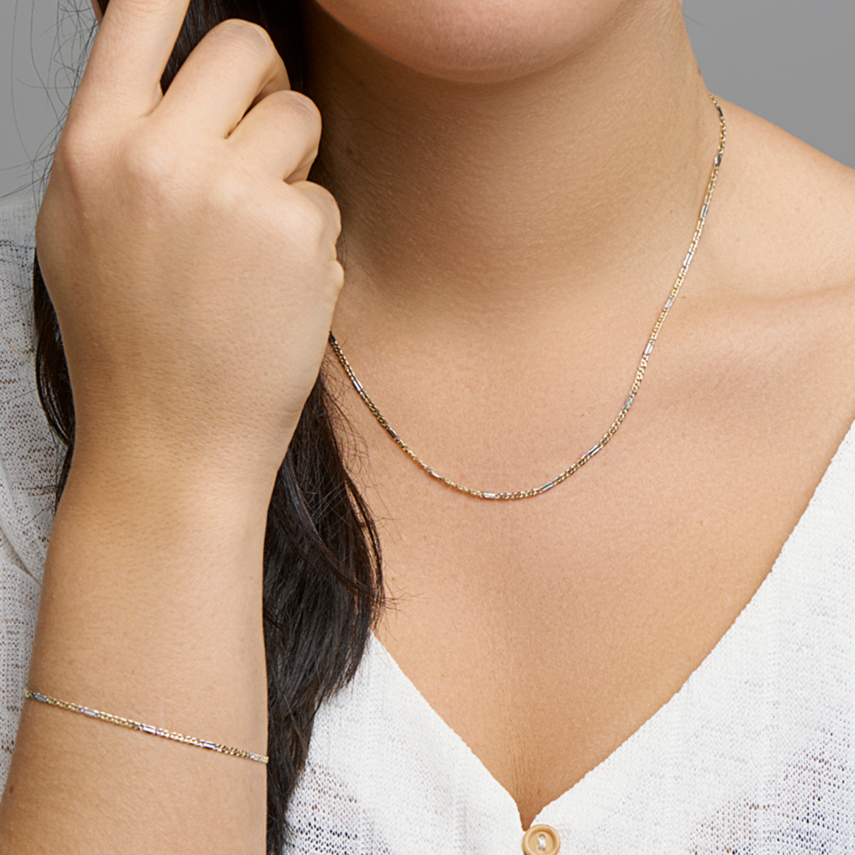 Armband valkenoog met tussenstuk 1,9 mm 14k bicolor goud geel/wit