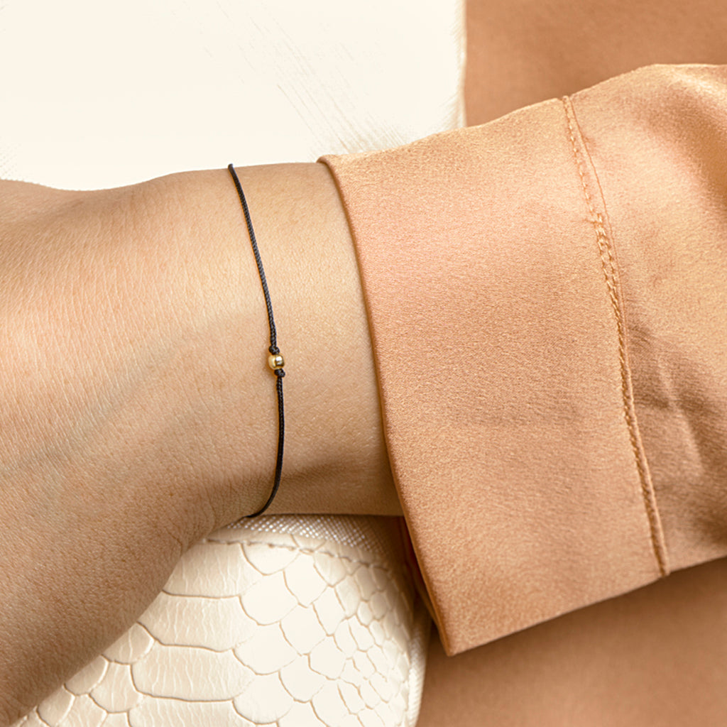 Armband katoen bolletje 13 - 19 cm 14k goud met rubber/nylon/leer