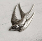 Broche bronzen zwaluw