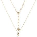 vergulde ketting met bloem en pareltje