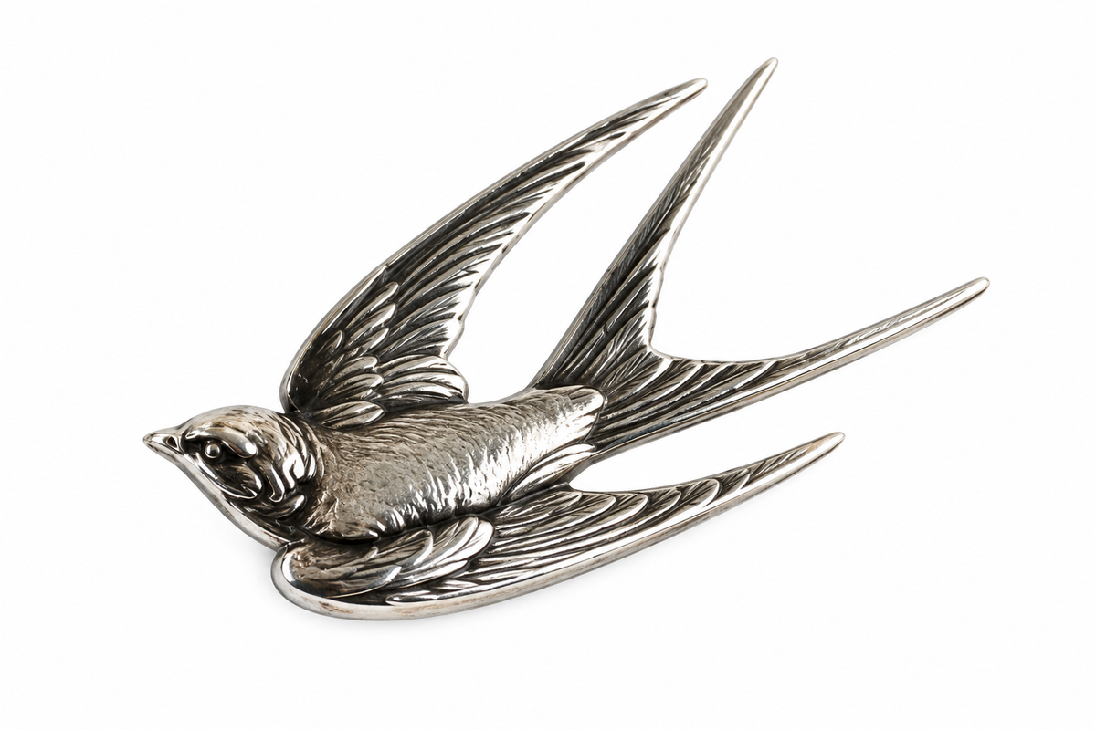 Schwalbenbrosche aus Bronze